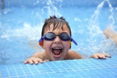 child-swim-poolside